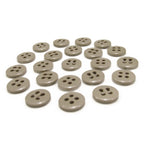 Twenty flat, round, gray Trouser Fly Pant Buttons—each with two or four holes—are arranged in neat rows on a white surface.