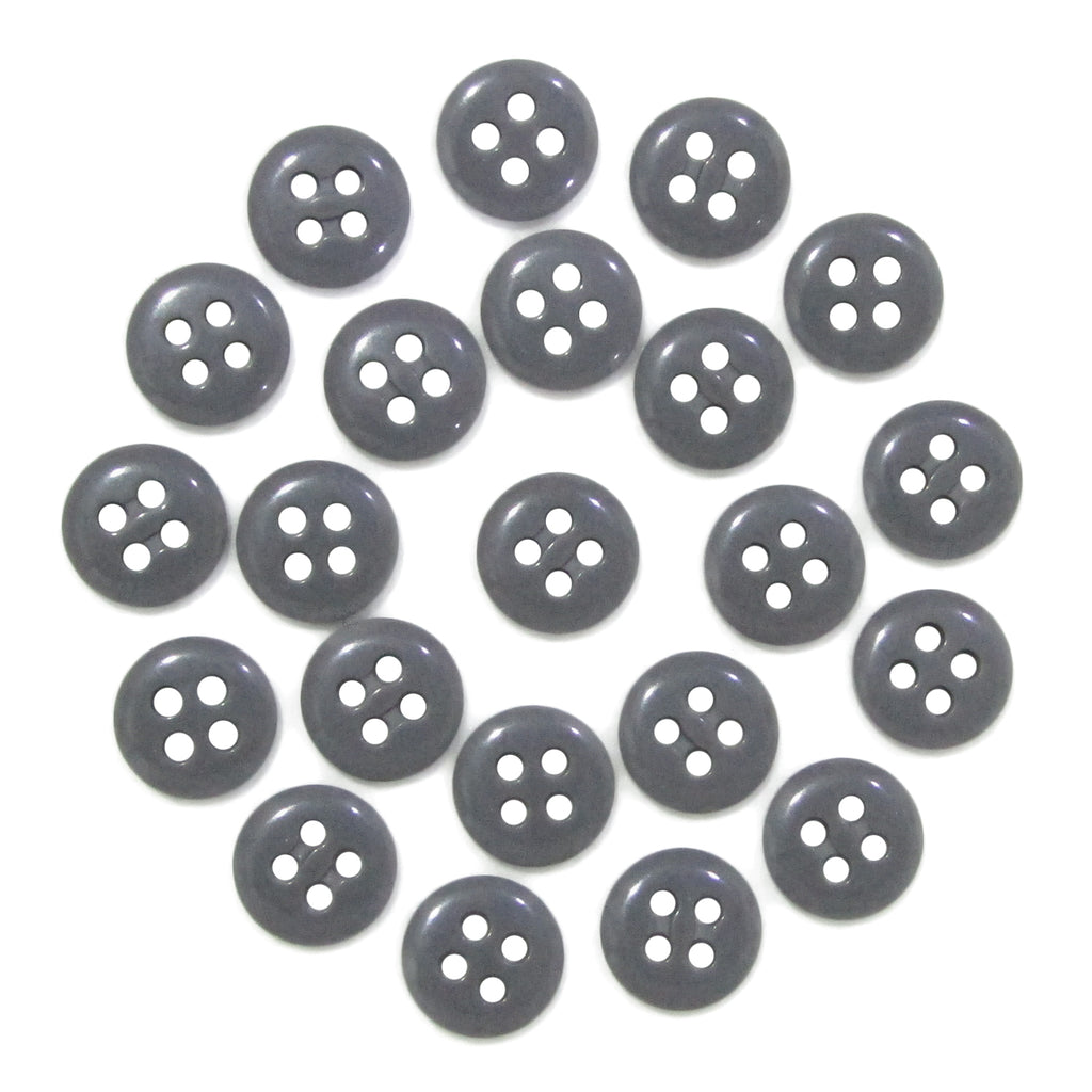 Twenty Trouser Fly Pant Buttons, each black with four holes, are arranged in a circle on a white background.