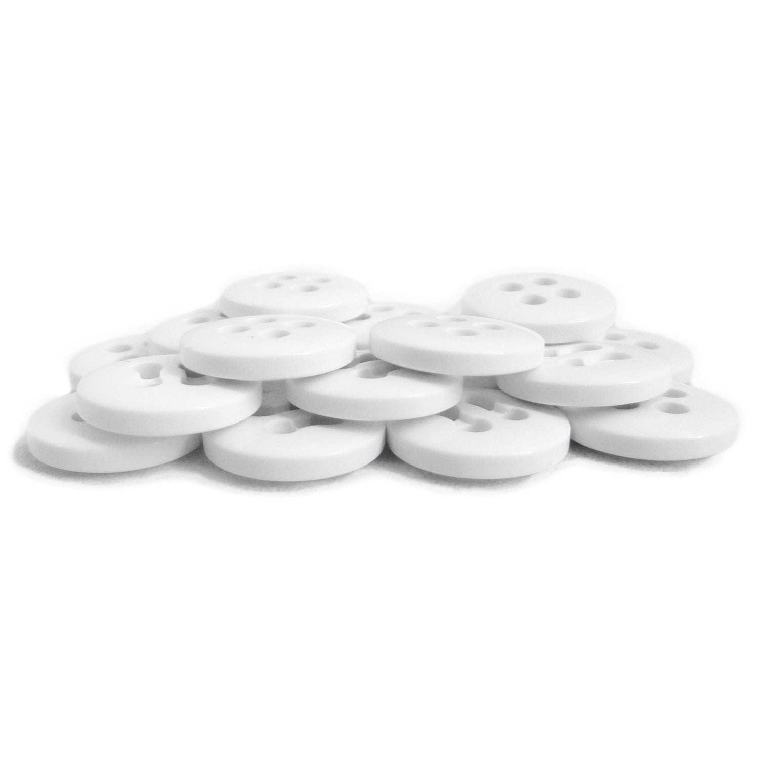 A pile of round white Trouser Fly Pant Buttons with four holes each, arranged on a white background.