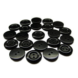 Several black round Commercial Food Service Buttons, each with two holes, are neatly arranged in a semicircle on a white background.