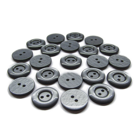 A set of round black and gray Commercial Food Service Buttons, each with two holes, displayed on a white background.