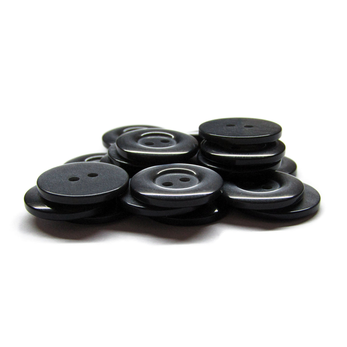 A pile of black, round Commercial Food Service Buttons with two holes each—perfect as plain uniform buttons—set against a white background.