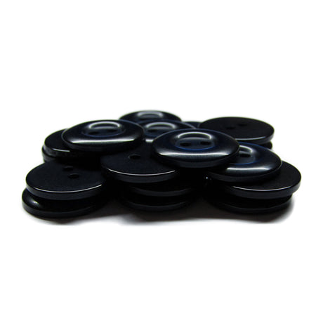 A stack of round, black Commercial Food Service Buttons with four holes each on a white background—perfect as plain uniform buttons for any work attire.