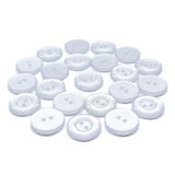 Several Commercial Food Service Buttons, white, round, and featuring two holes, are scattered on a plain white background.