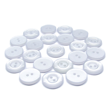 Several Commercial Food Service Buttons, white, round, and featuring two holes, are scattered on a plain white background.