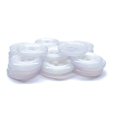 A stack of translucent white Commercial Food Service Buttons with two holes is displayed on a white surface, offering a modern alternative to the classic black nylon buttons typically found on work uniforms.