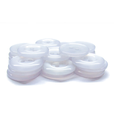 A stack of translucent white Commercial Food Service Buttons with two holes is displayed on a white surface, offering a modern alternative to the classic black nylon buttons typically found on work uniforms.