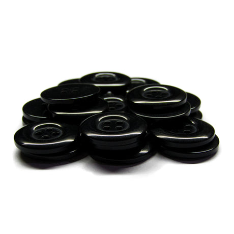 A stack of Commercial Food Service Buttons, glossy black and ideal for uniforms, arranged neatly on a white background.