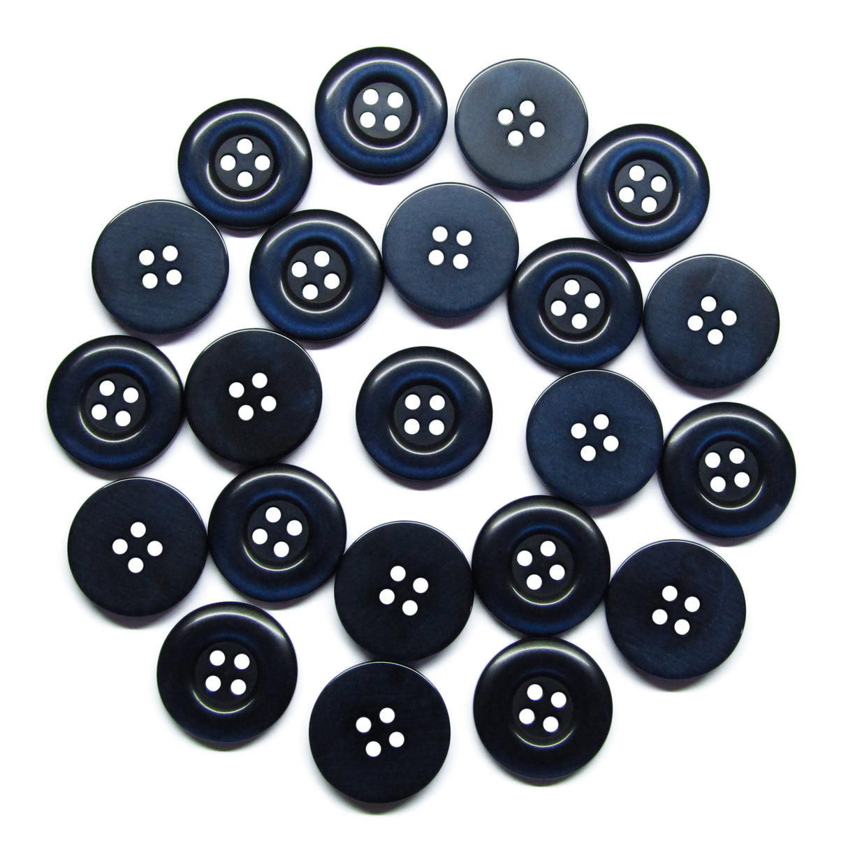 Twenty-three Commercial Food Service Buttons made of black nylon, each with four holes, are scattered in a circular pattern on a white background.