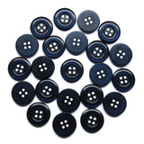 Twenty-three Commercial Food Service Buttons made of black nylon, each with four holes, are scattered in a circular pattern on a white background.