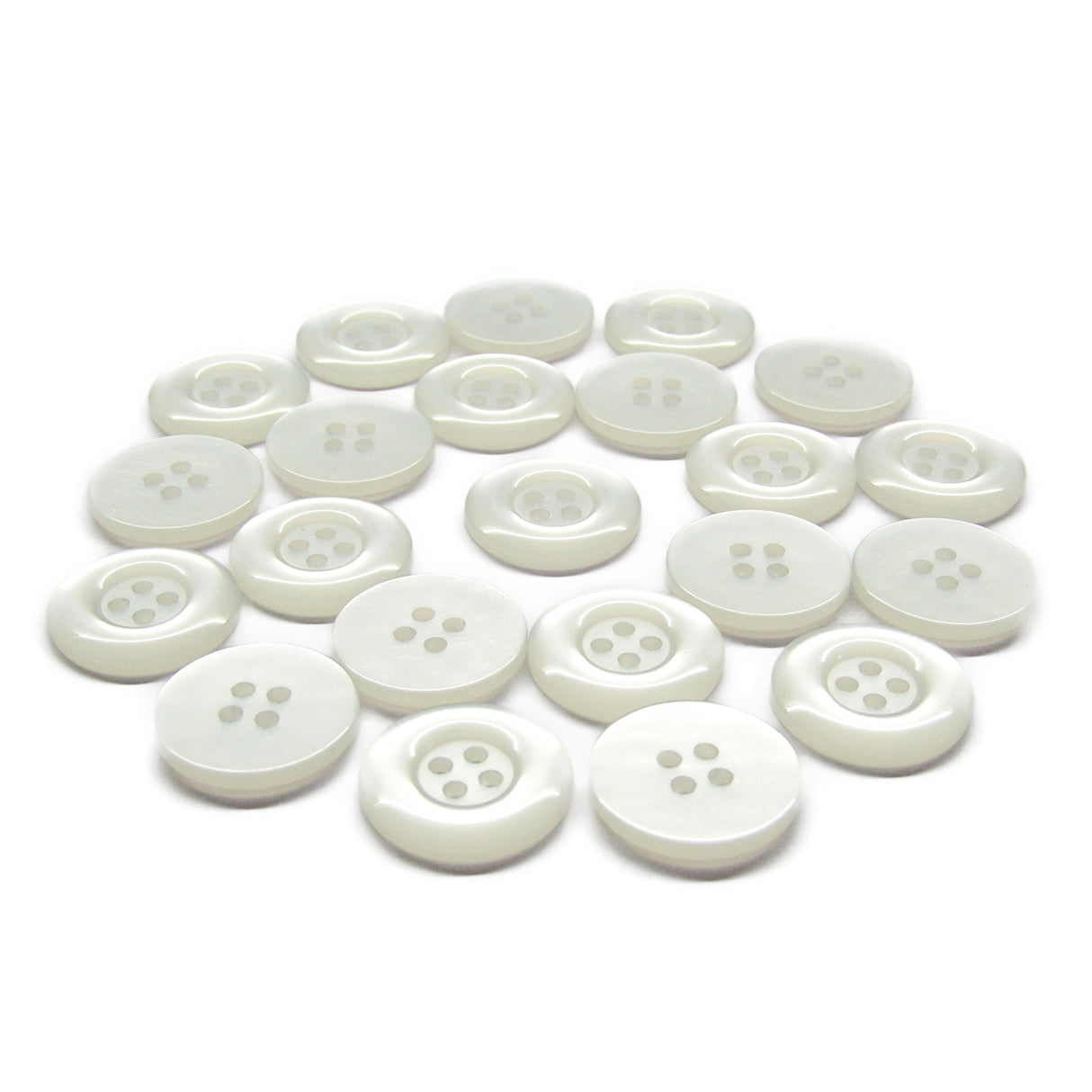 A scattered group of small, round, white Commercial Food Service Buttons with four holes is displayed on a white background.