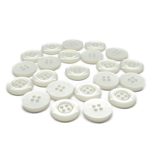 A scattered group of small, round, white Commercial Food Service Buttons with four holes is displayed on a white background.