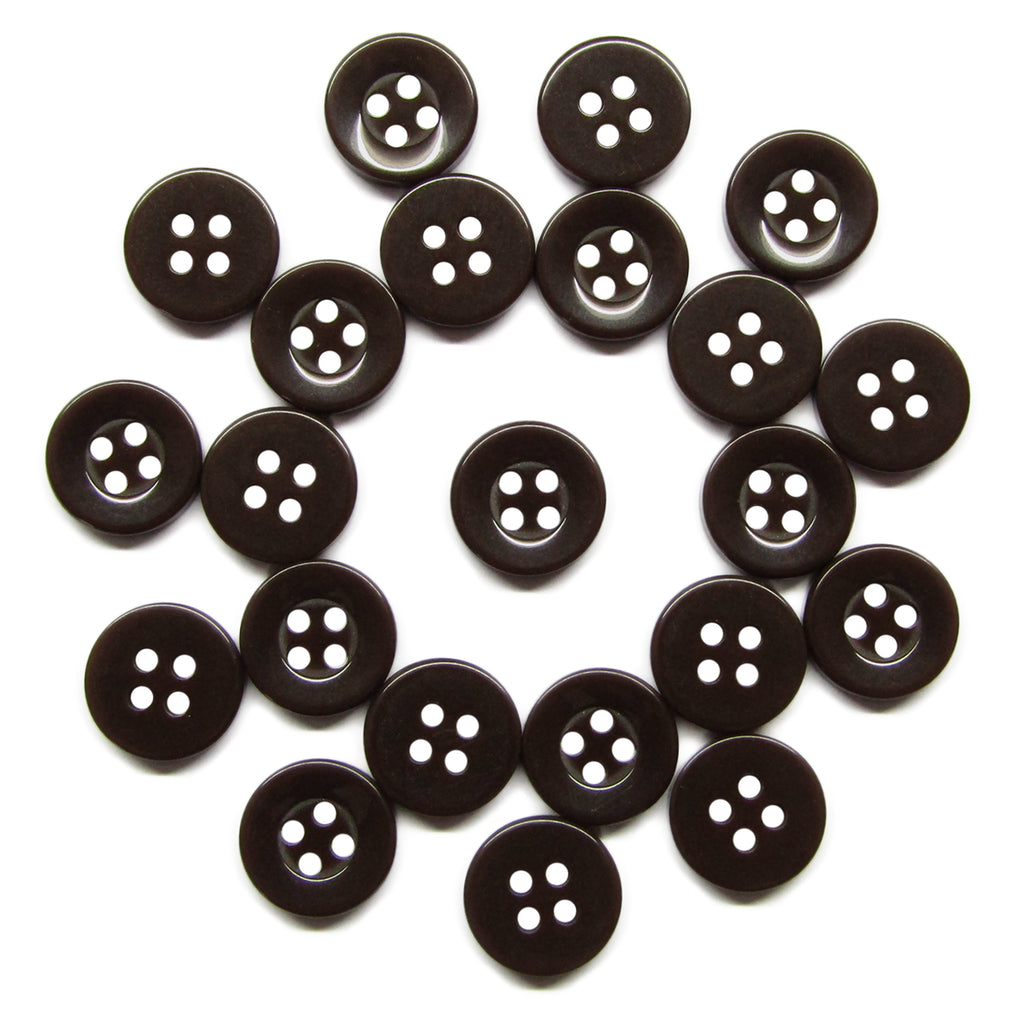 Twenty-one Workshop Uniform Shirt Buttons, made of durable black nylon with four holes each, are arranged in a loose circle on a white background.