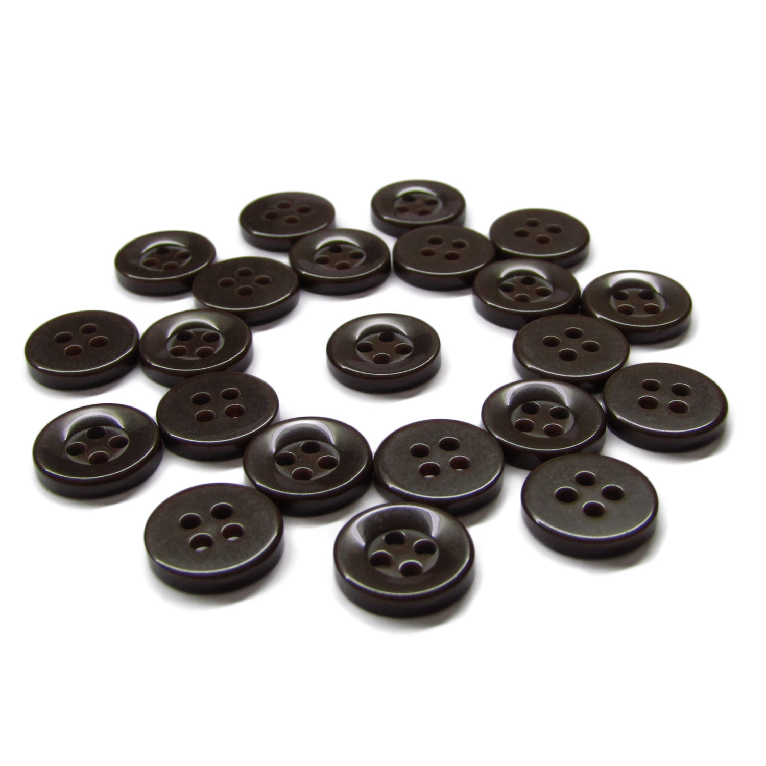 A set of black, four-hole Workshop Uniform Shirt Buttons made from durable nylon, displayed on a white surface.