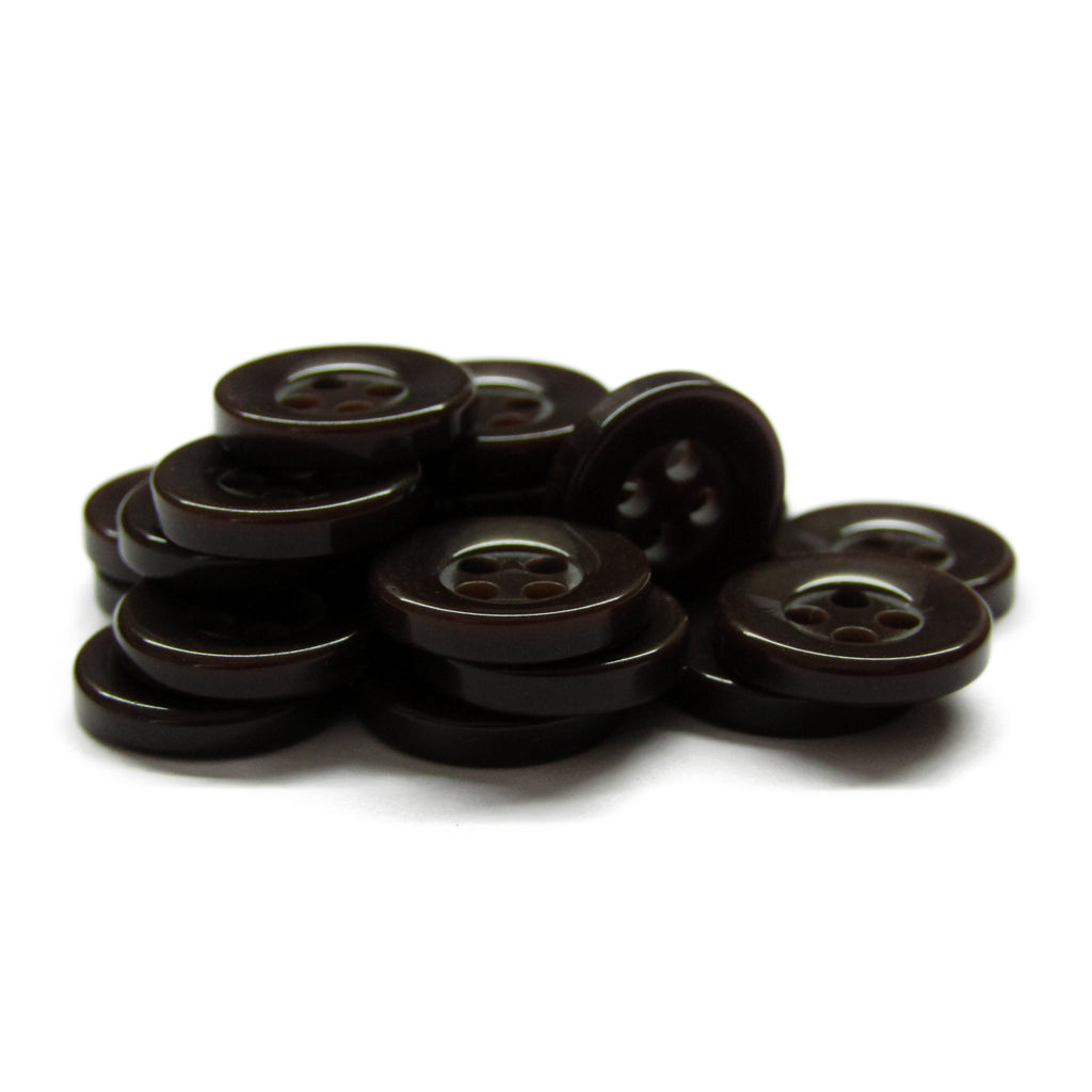 A pile of small, round, dark brown Workshop Uniform Shirt Buttons made of durable nylon with four holes on a white background.