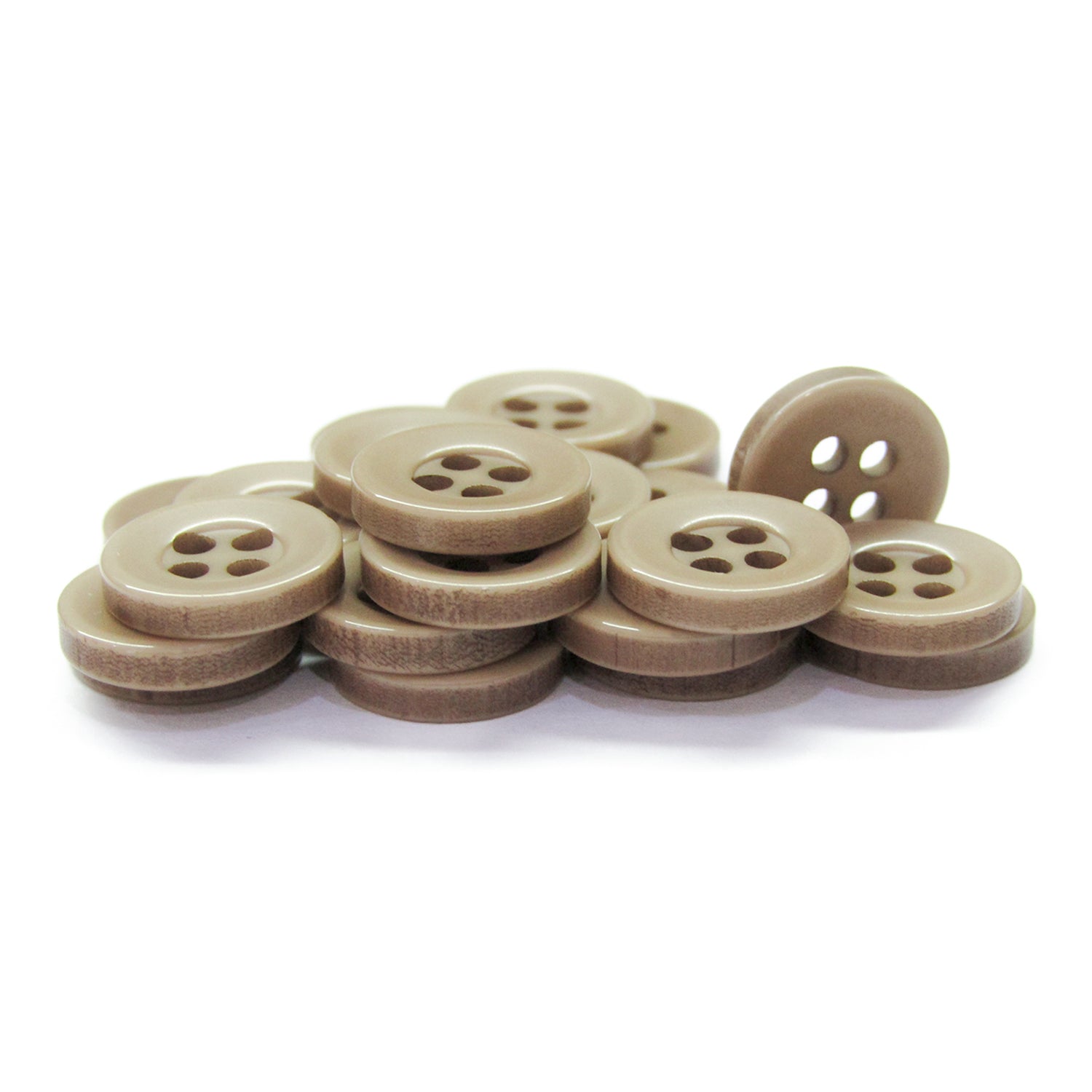 A stack of Workshop Uniform Shirt Buttons—light brown, four-hole, durable nylon—displayed on a white background.