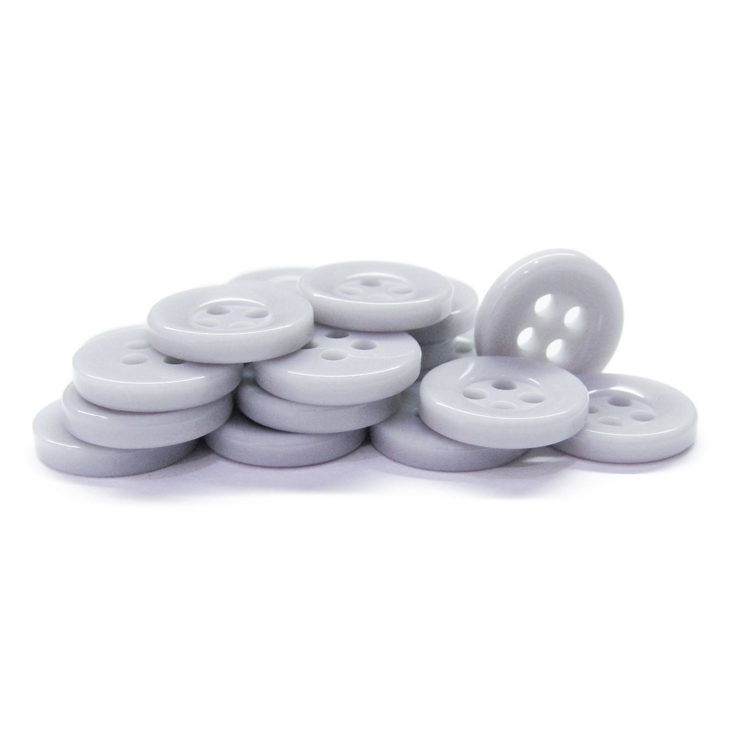A pile of Workshop Uniform Shirt Buttons—round, light gray, four-hole durable nylon—displayed on a white background.