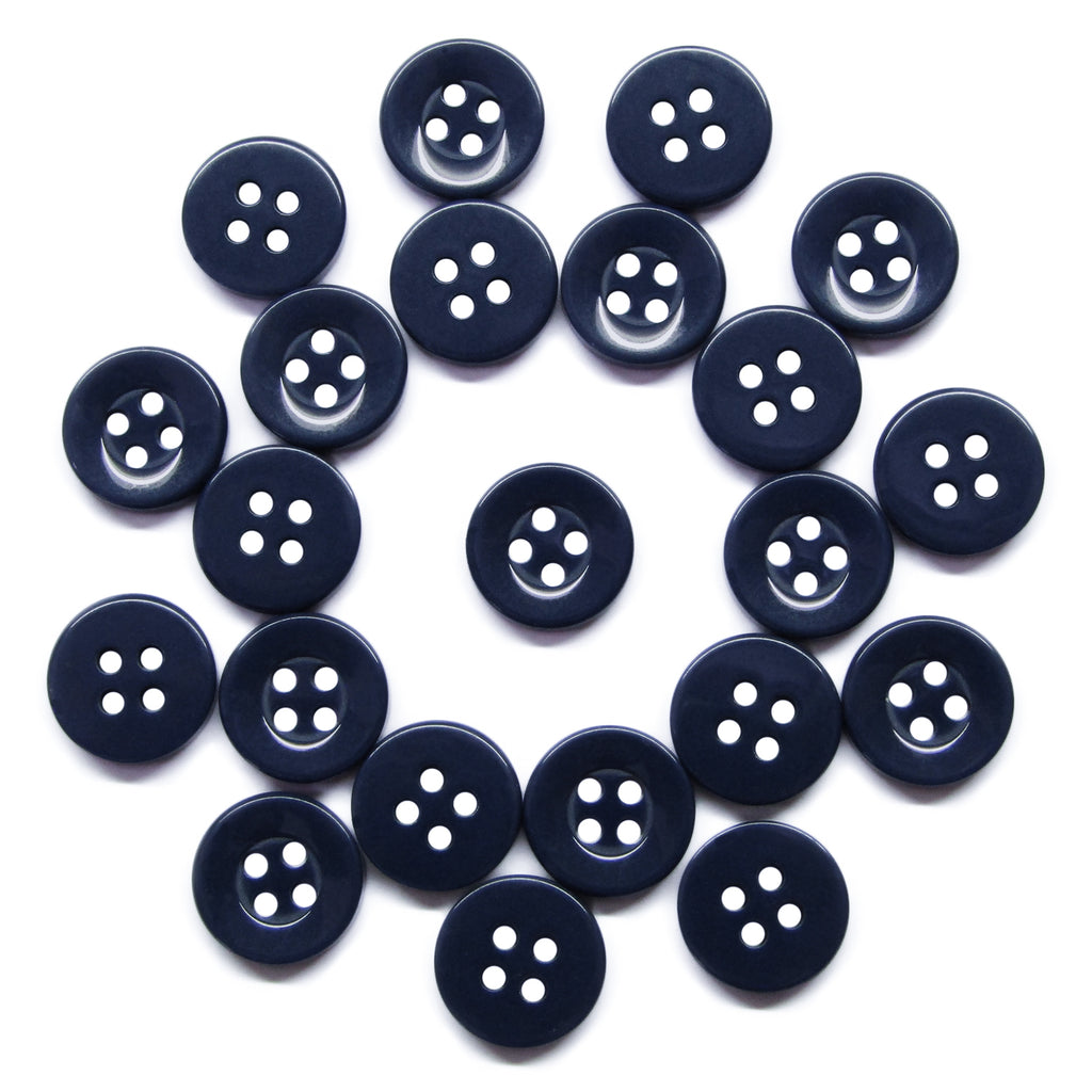 Twenty-one Workshop Uniform Shirt Buttons, made of durable navy blue nylon, are arranged in a circle on a white background.