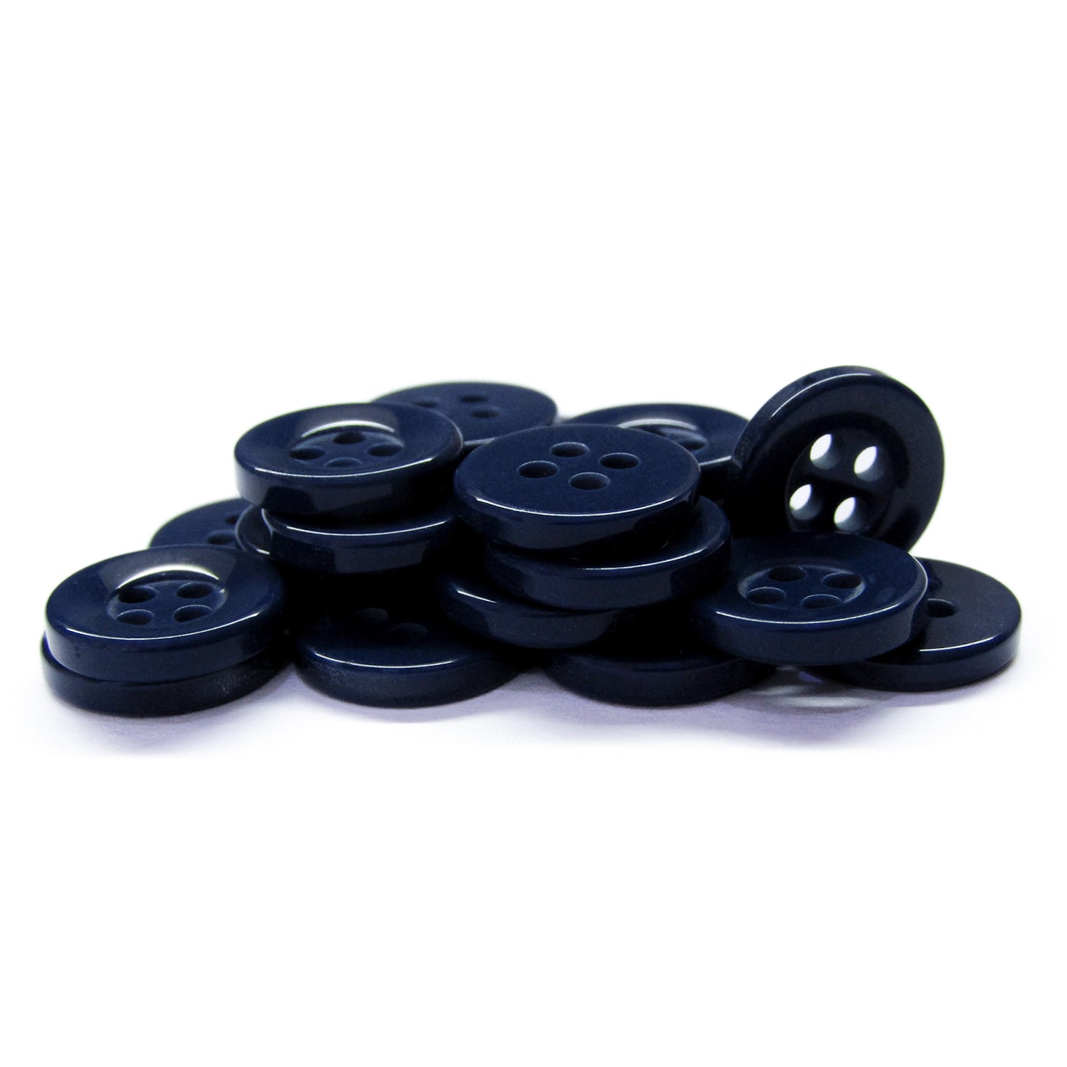 A stack of Workshop Uniform Shirt Buttons in dark navy blue, made from durable four-hole nylon, displayed on a white background.