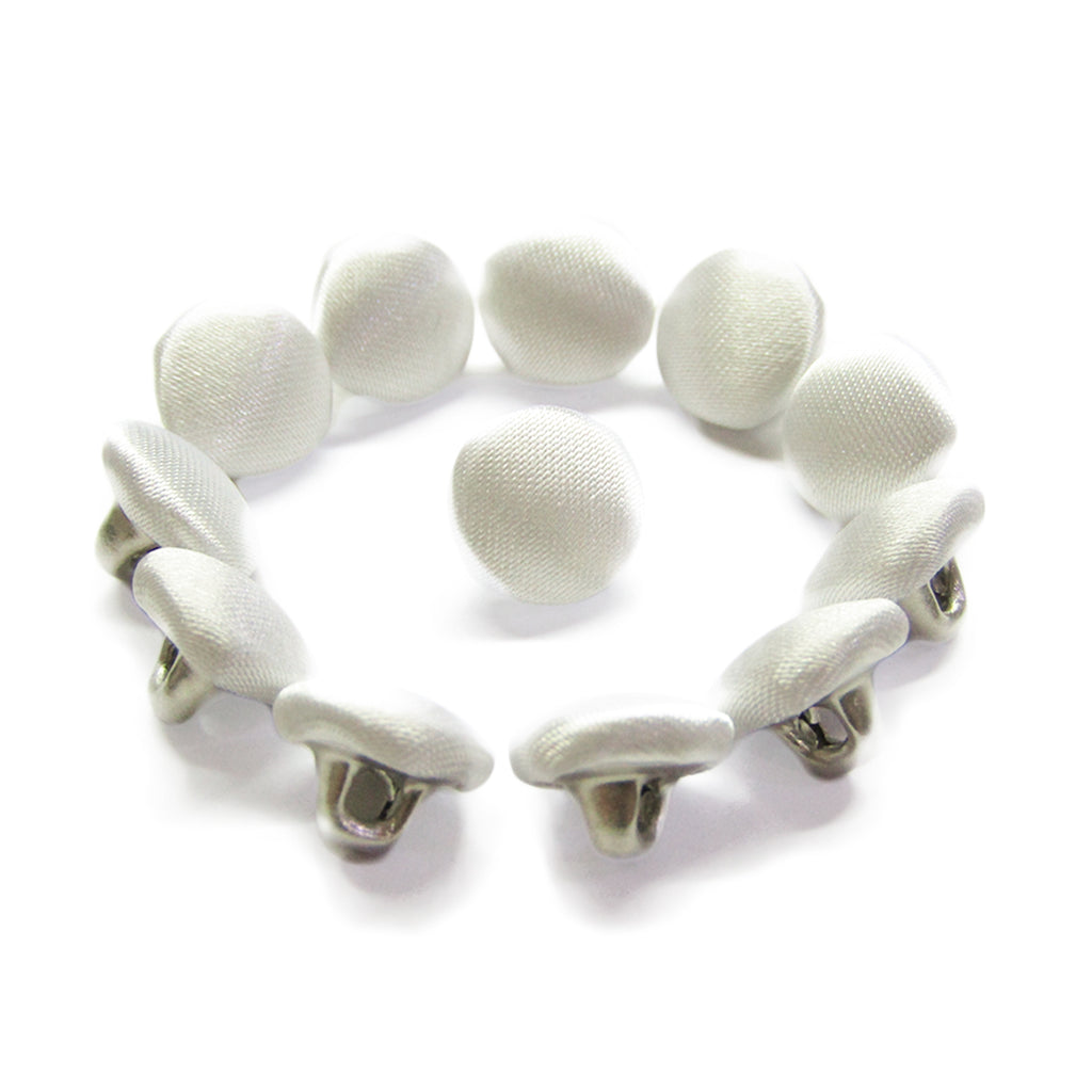 A circle of Silk Satin Bridal Buttons with metal backs, featuring one bridal button at the center.