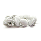 A pile of Silk Satin Bridal Buttons, small, round, and white, on a white background—perfect for adding an elegant touch to any wedding dress.