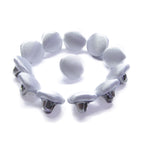 Ten Silk Satin Bridal Buttons, inspired by wedding dress designs, are arranged in a semicircle with one centered, all displayed on a white background.