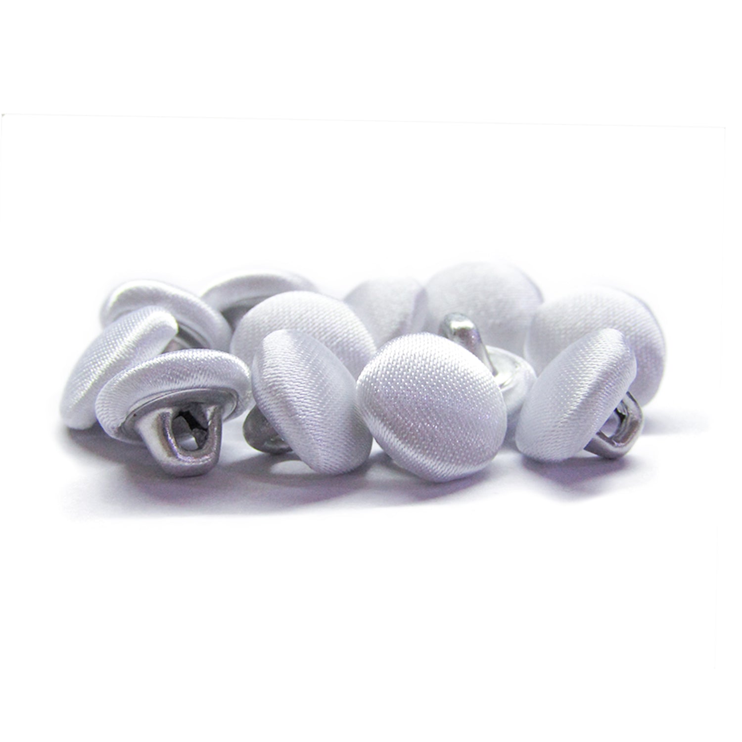 A pile of Silk Satin Bridal Buttons with metal shanks rests on a white background, perfect for adding classic detail to wedding dress designs.