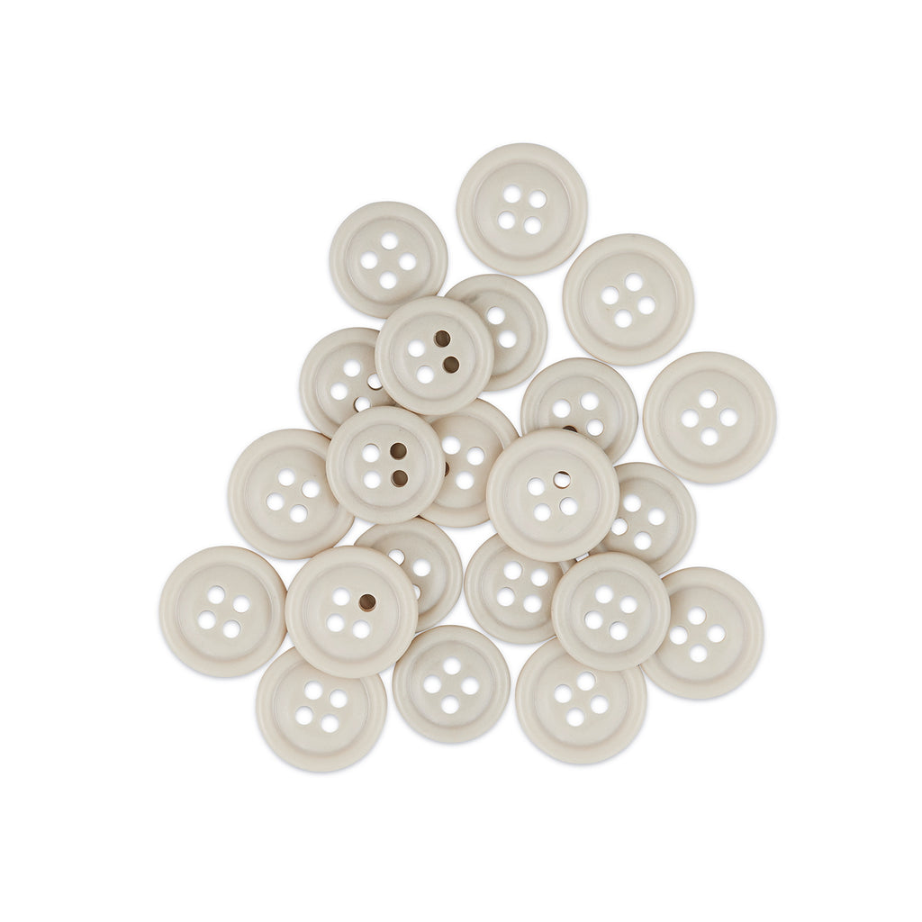 A pile of beige Cargo Utility Pant Buttons, made from four-hole nylon plastic, arranged on a white background—ideal replacement buttons for cargo pants.