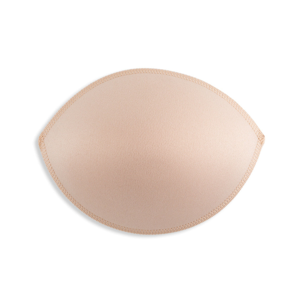 A single beige Padded Bra Cup Insert, oval-shaped with stitched edges, designed as a discreet bra padding enhancer, shown on a white background.