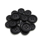 A selection of Luxury Suit Buttons in black, featuring four holes and various sizes, is displayed against a white background.
