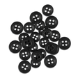 A pile of scattered black Replacement Shirt Buttons from a tailor's kit rests on a white background.