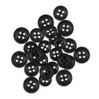 A pile of scattered black Replacement Shirt Buttons from a tailor's kit rests on a white background.