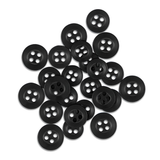 A pile of scattered black Replacement Shirt Buttons from a tailor's kit rests on a white background.