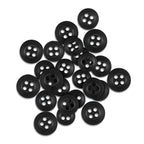A collection of black, four-hole Replacement Shirt Buttons with a matte poly-nylon finish is displayed on a white background.
