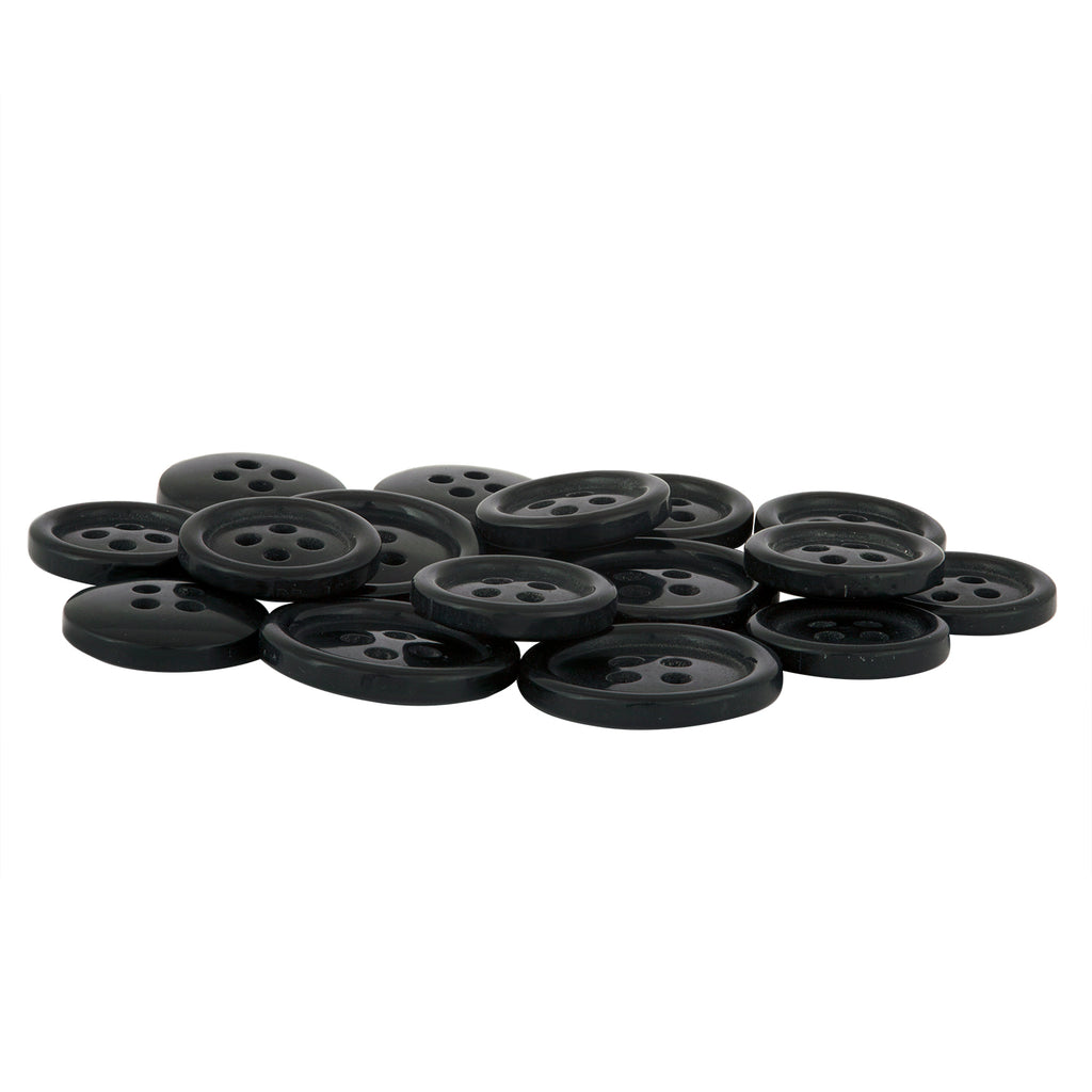 A pile of Standard Suit Buttons, black, round, and four-holed, is scattered on a white surface.