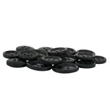A pile of Standard Suit Buttons, black, round, and four-holed, is scattered on a white surface.