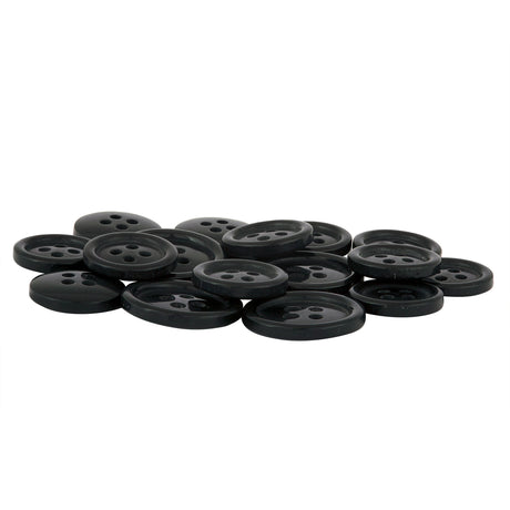 A pile of Standard Suit Buttons, black, round, and four-holed, is scattered on a white surface.