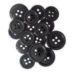 A variety of black, round Standard Suit Buttons with four holes in assorted sizes on a white background—ideal replacements for your black blazer.