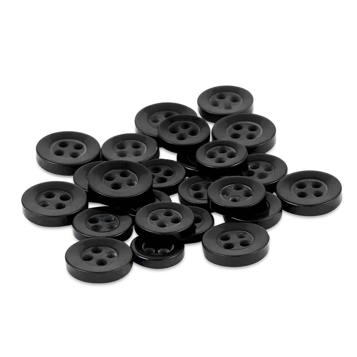 A pile of Replacement Shirt Buttons scattered on a white surface, featuring classic black, four-hole poly-nylon buttons ideal for any tailor’s kit.