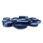 A pile of smooth, flat, translucent blue Luxury Suit Buttons on a white background, evoking the look of elegant accents for upscale ensembles.