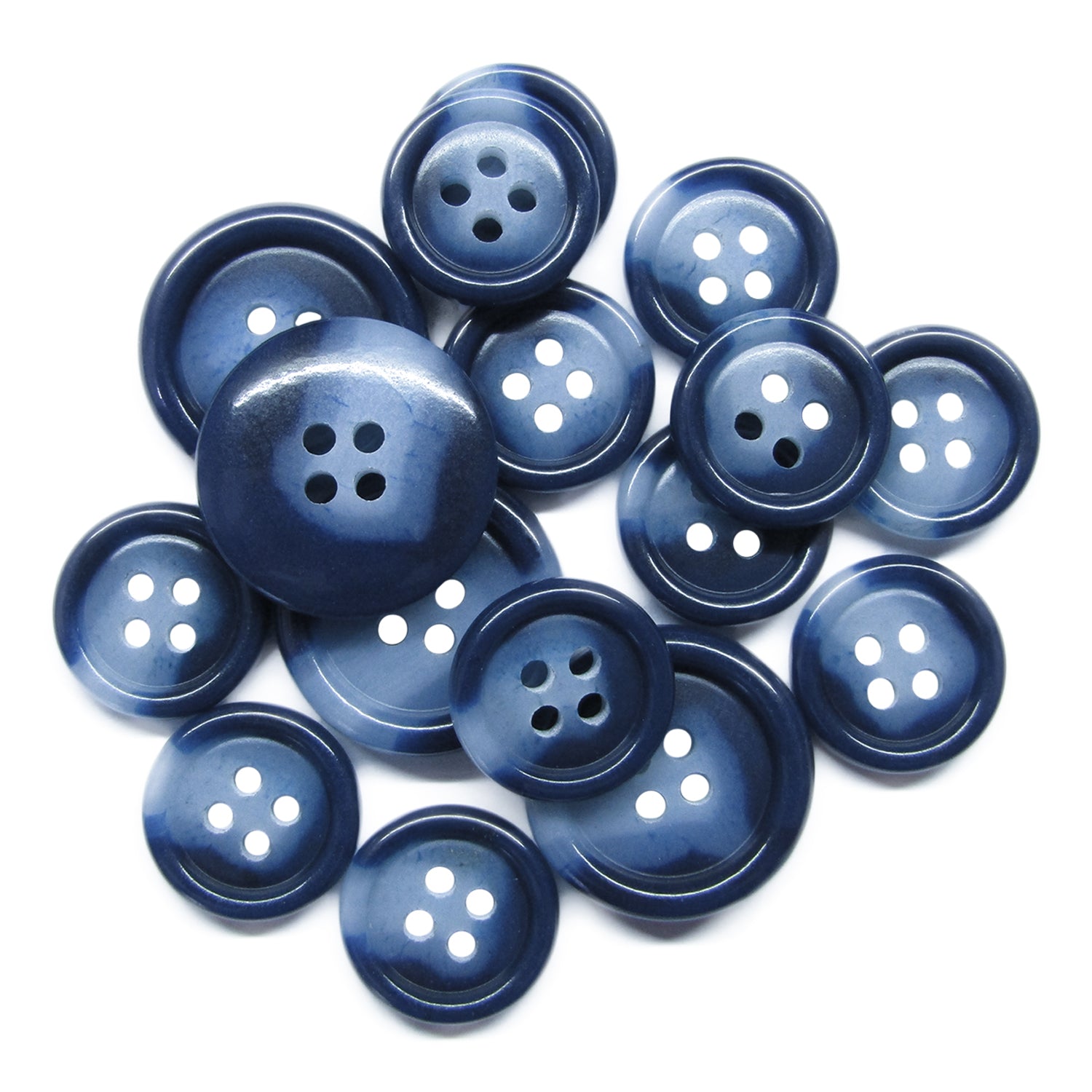 A scattered pile of Luxury Suit Buttons in dark blue with four holes, arranged on a white background.