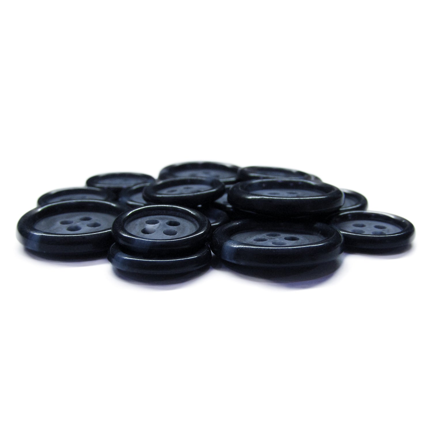 Luxury Suit Buttons in black with four holes are stylishly arranged on a white surface.