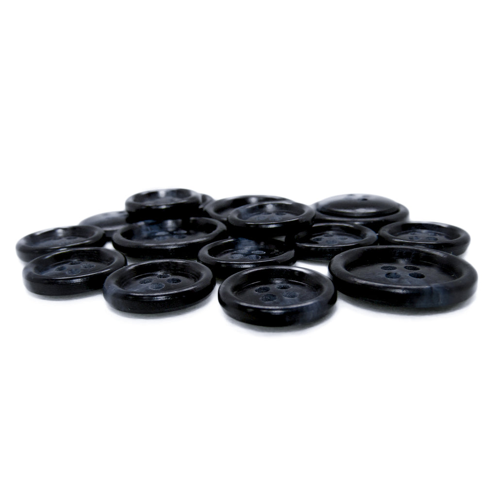 Premium Suit Buttons in black are displayed in a scattered pile on a white background.