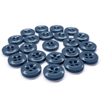 A 22-pack of Work Shirt Buttons, navy blue and military spec, is arranged in a neat cluster on a white surface.