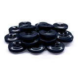 A pile of Work Shirt Buttons, black with four holes, stacked on a white surface.