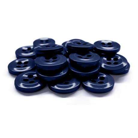 A stack of Work Shirt Buttons in dark blue military spec with four holes, arranged on a white surface.