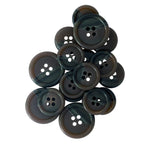 A cluster of Vegan Faux Horn Suit Buttons, dark and round, arranged in an overlapping pile on a white background.