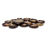 Several Premium Suit Buttons in brown and tan are scattered and overlapping on a white surface.