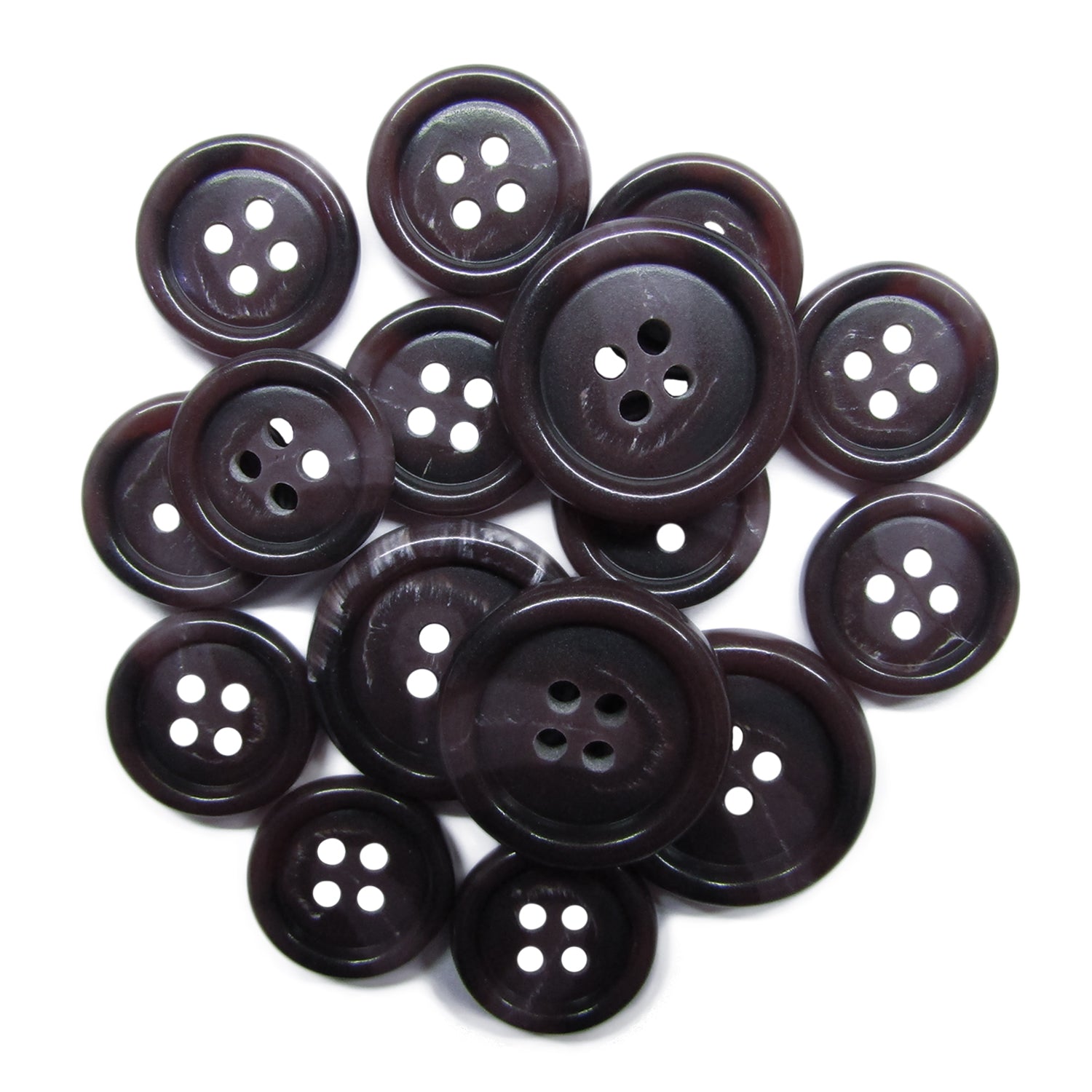 A pile of Luxury Suit Buttons, dark and round with four holes, arranged on a white background.