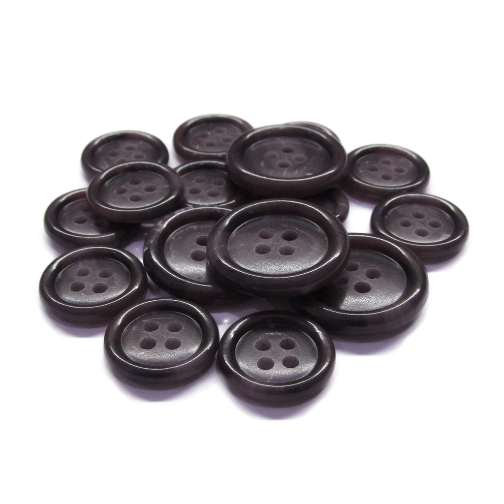 A pile of round, dark brown Luxury Suit Buttons with four holes is displayed on a white background.